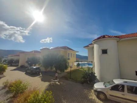 Akbük'te Havuzlu Sitede 2+1 Zemin Kat